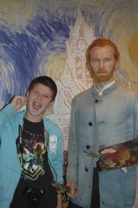 Thing 1 getting cheeky with the wax figure of Vincent Van Gogh.